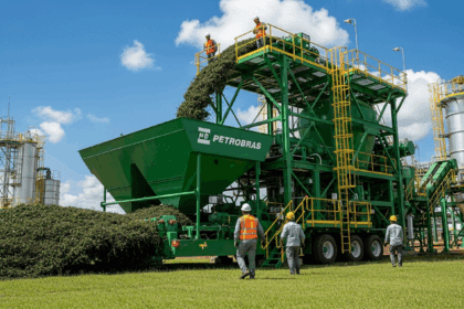 A dynamic industrial scene showcasing the launch of fertilizer production by Petrobras in Northeast Brazil, featuring advanced machinery, lush green landscapes, and workers in modern gear actively engaged in the process, complemented by a vibrant sky. no texts on scene. Keywords: photorealistic style, high resolution, 4k details, HDR, cinematic lighting, professional photography, studio lighting, vibrant colors.